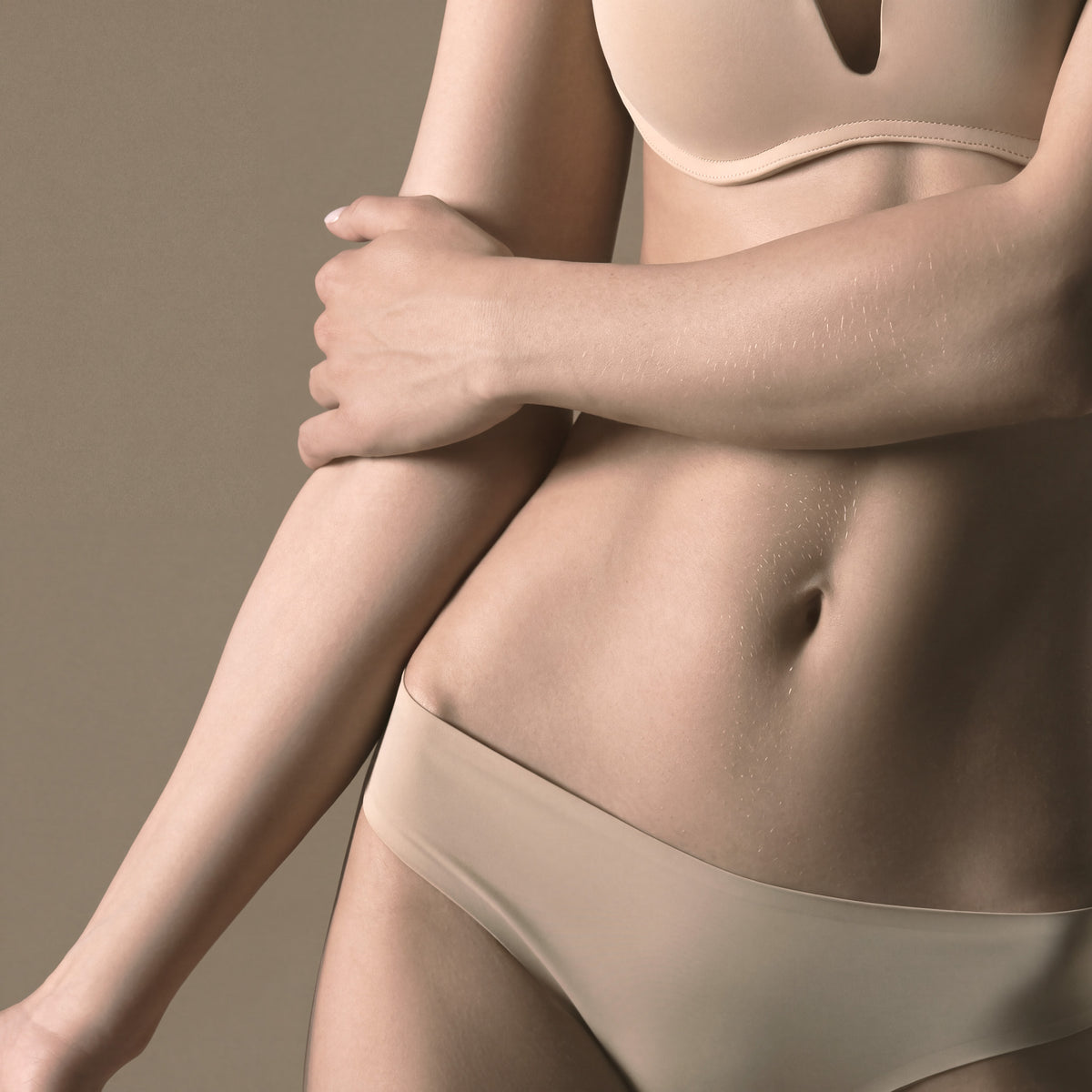 Stomach strip treatment area highlighted for laser hair removal at Bare Beauty Collective in Suffern, NY